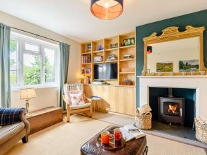 a living room with a fireplace and a mirror at 3 bed in Glasbury-on-Wye BN289 in Glasbury