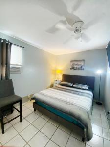 a bedroom with a bed and a ceiling fan at Entire Home Near Cordova Intl Bridge in El Paso