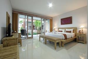 Postel nebo postele na pokoji v ubytování Batu Empug Ubud by Mahaputra + 37 fotografií