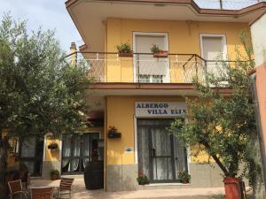 a building with a sign that reads albuquerque villa elite at Hotel Villa Elle in Loano
