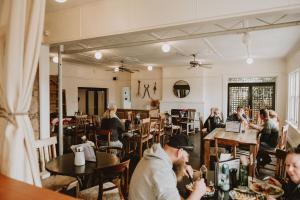 a group of people sitting at tables in a restaurant at The Kentish Tasmania in Oatlands