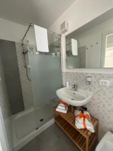 a bathroom with a sink and a shower at Tra campagna e mare in Lido delle Nazioni +26 photos