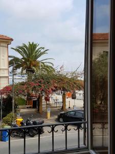a view from a window of a street with a car at Perla Nera Guesthouse in Imperia