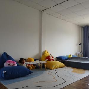 a room with pillows and a table in a room at My room Net 1 in Lamphun +24 photos
