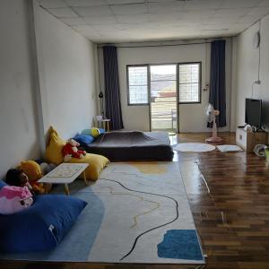 a living room with a couch and a rug at My room Net 1 in Lamphun