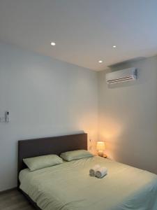 Ένα ή περισσότερα κρεβάτια σε δωμάτιο στο Vero 3-Bedroom Homestay