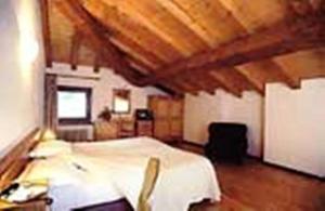 Postel nebo postele na pokoji v ubytování À l'Hostellerie Du Paradis