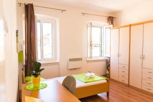 a small room with a table and a chair at Apartment Mia in Rijeka