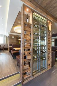 a wine cellar with a wall of wine bottles at Hotel-Restaurant Schweinberger in Stetten