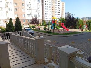 a playground with a slide and a play park at Апартаменты у моря м Южне in Sychavka