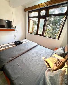 Ένα ή περισσότερα κρεβάτια σε δωμάτιο στο Hotel peace