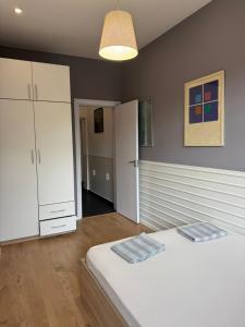 Ένα ή περισσότερα κρεβάτια σε δωμάτιο στο Happy Day