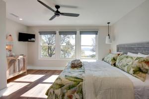 a bedroom with a bed and a ceiling fan at Magical Family Cabin with Breathtaking Beauty and Modern Interior in Alabama in Grant