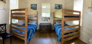 a bedroom with two bunk beds in a house at Lakeside Cabin for a Glamping Getaway near Tampa, Florida in Eastgate