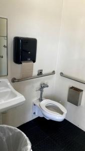 a bathroom with a toilet and a sink at Cabin 3 - Reservoir View Bunk House in Bradenton, FL in Eastgate