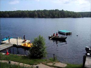 a group of people in a boat on a lake at Tranquil Weekend Getaway Close to Chequamegon National Forest in Wisconsin in New Post