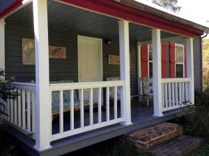 a front porch of a house with a white railing at Pet-Friendly Cabin Rental for Family Getaway in Lexington, Virginia in Timber Ridge