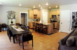 a kitchen and living room with a dining table and a kitchen with at Luxurious Pet-Friendly Vacation Rental close to Mirror Lake in Kamas, Utah in Kamas