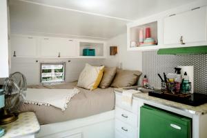 a living room with a couch in a caravan at Remote Vintage Camper Rental for Adult-Only Retreat in Franklin, North Carolina in Franklin