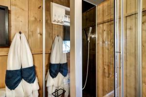 a bathroom with two towels hanging on a wall at Incredible Tented Cabin with Fire Pit and Hot-tub in Sevierville, Tennessee in Wear Valley +37 photos