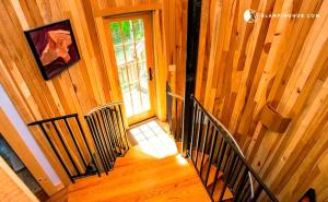 an overhead view of a staircase in a wooden house at Peaceful Getaway above a Beautiful Yoga Studio near Devil's Den Nature Preserve, Connecticut in Redding