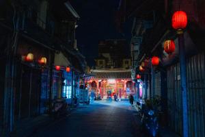 a city street at night with red lanterns at Beishan Old Western Style Hostel in Jinning