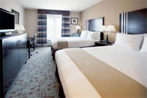 a hotel room with two beds and a flat screen tv at Holiday Inn Express Hotel & Suites Houston NW Beltway 8-West Road, an IHG Hotel in Houston
