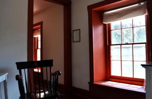 a room with a window and a chair in it at Historic Bed and Breakfast Accommodation Built in 1790 in Bucks County, Pennsylvania in Buckingham