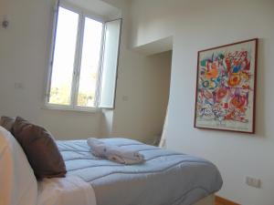 Postel nebo postele na pokoji v ubytování Circo Massimo stanze