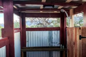 a bathroom with a window and a shower in a room at Unique Tipi Accommodation for a Glamping Experience near Las Vegas, Nevada in Sandy Valley