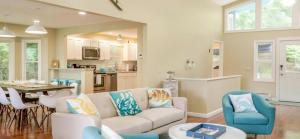 a living room with a couch and a table at Tranquil Lakefront Cottage with Private Dock in Ticonderoga, New York in Glenburnie