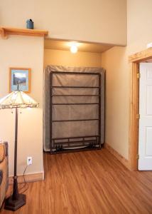 a room with a iron gate in the corner of a room at Eco-Friendly Cabin with Views of the Rocky Mountains in Colorado in Monarch +21 photos
