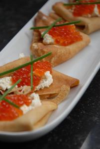 a white plate with three different types of food on it at Weena House in Rotterdam