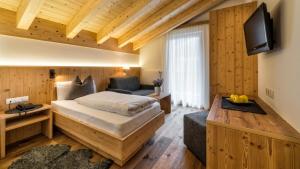 Postel nebo postele na pokoji v ubytování Hotel Moritz