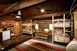 a room with two bunk beds in a cabin at Unique Camping Cabin Tucked in Wilderness near Steamboat Springs, Colorado in Columbine