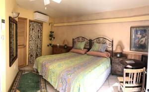 a bedroom with a large bed in a room at Peaceful Vacation Suite Rental Overlooking Mescal Canyon in Clarkdale, Arizona in Jerome +20 photos