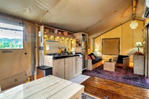 a kitchen and living room in a tent at Glorious Tented Cabin with Fire Pit and Gorgeous Sky Views in Sevierville, Tennessee in Wear Valley