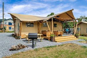 a tent with a picnic table and a grill at Glorious Tented Cabin with Fire Pit and Gorgeous Sky Views in Sevierville, Tennessee in Wear Valley +36 photos