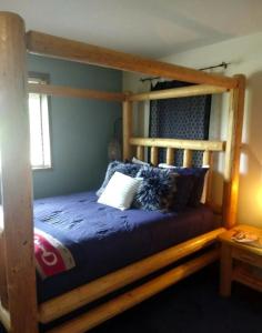 a bedroom with a wooden bunk bed with pillows at Cozy Bed and Breakfast Suite for Romantic Getaway near Skagit Bay, Washington in Maple Grove Beach