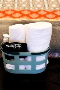 a blue basket filled with white toilet paper at Scenic Northern Michigan Glamping Tent on a Regenerative Farm in Elmira +7 photos