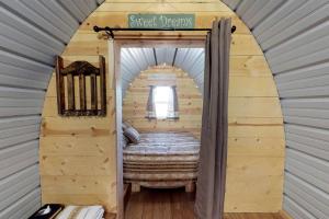 a small bedroom in a tiny house at Amazing Glamping Village Ideal for Groups or Big Family Getaways in Utah in Verdure +38 photos