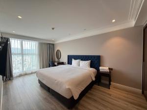 Ένα ή περισσότερα κρεβάτια σε δωμάτιο στο Ocean View Luxury Apartment Đà Nẵng +32 φωτογραφίες