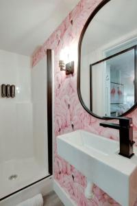 a bathroom with a sink and a mirror at Colorful Tiny House with Outdoor Sauna and Jacuzzi in Alabama in Grant +28 photos