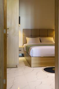 Ένα ή περισσότερα κρεβάτια σε δωμάτιο στο La Prestigia luxury Apartments by Peaks