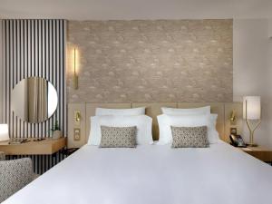 Postel nebo postele na pokoji v ubytování Pullman La Pléiade Montpellier Centre