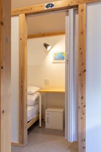 Postel nebo postele na pokoji v ubytování Almas Guest House(アルマス）