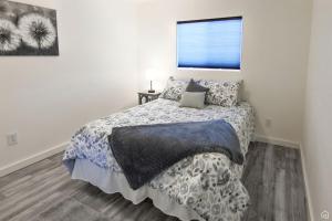 a bedroom with a bed and a window at Incredible Cottage Close to Fantastic Hiking Trails Blanding, Utah in Blanding