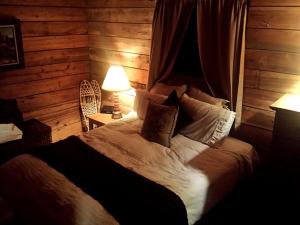 a bedroom with a large bed in a log cabin at Cozy Vacation Rental with High-Speed Wi-Fi near Seven Springs, Pennsylvania in Champion