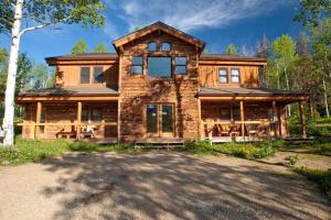 a large wooden house in the woods at Remote Cabin Rental near Pearl Lake in Mountains of Clark, Colorado in Columbine