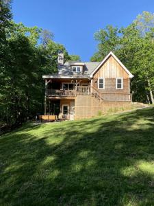 a house on a hill with a large yard at Tranquil Vacation Rental Nestled in the Shenandoah Mountains of Howardsville, Virginia in Howardsville